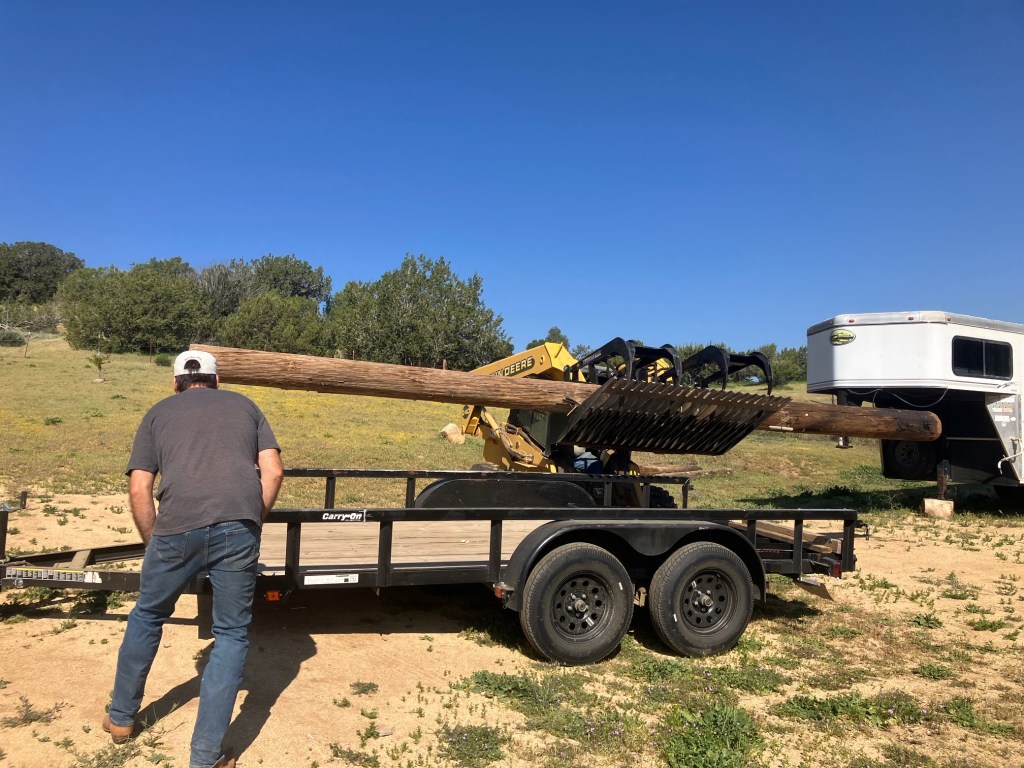 Loading up a phone pole from a neighbor.